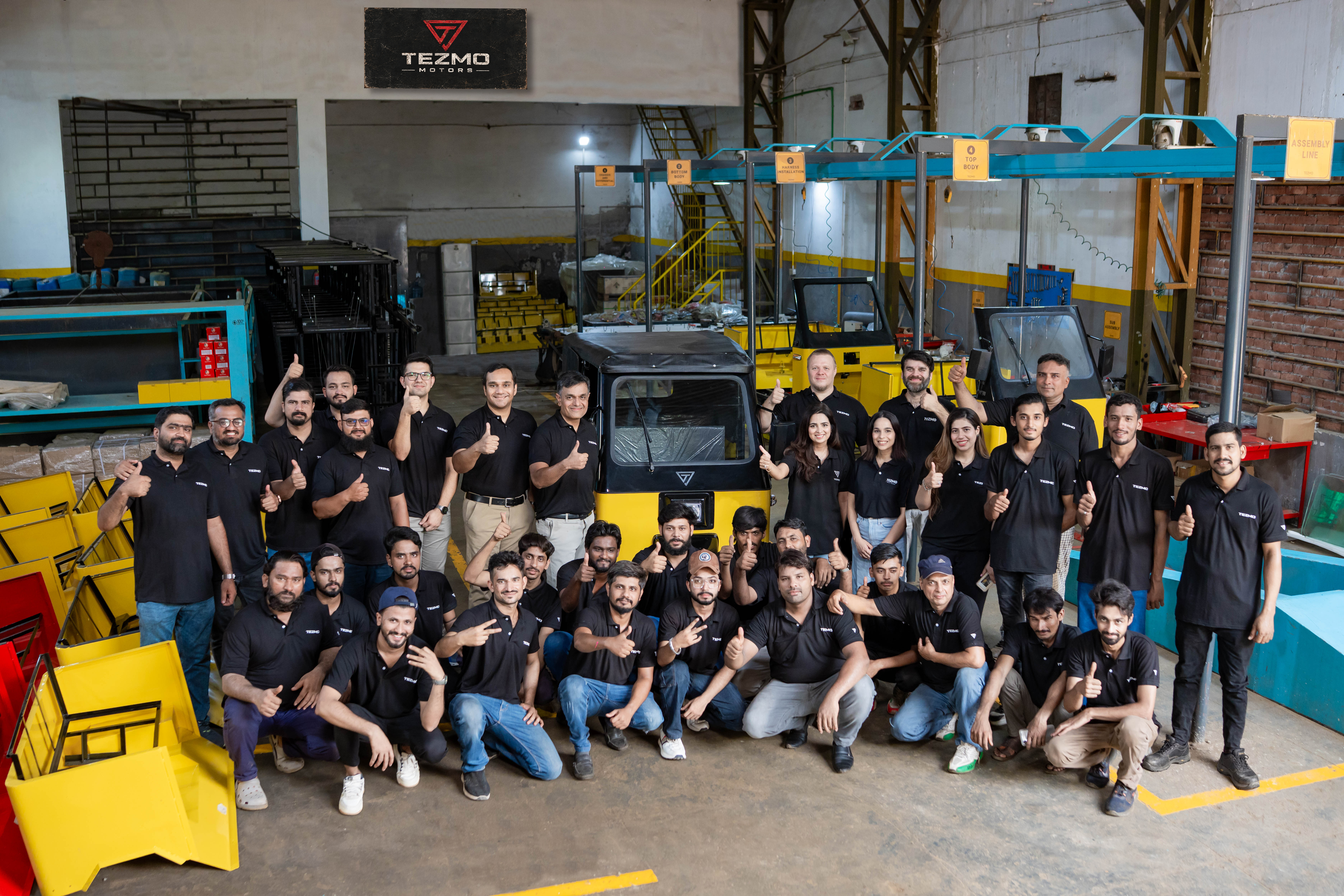 The Tezmo Motors team on the assembly line in Lahore